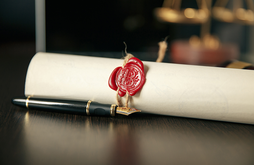 Notary's public pen and stamp on testament and last will. Notar